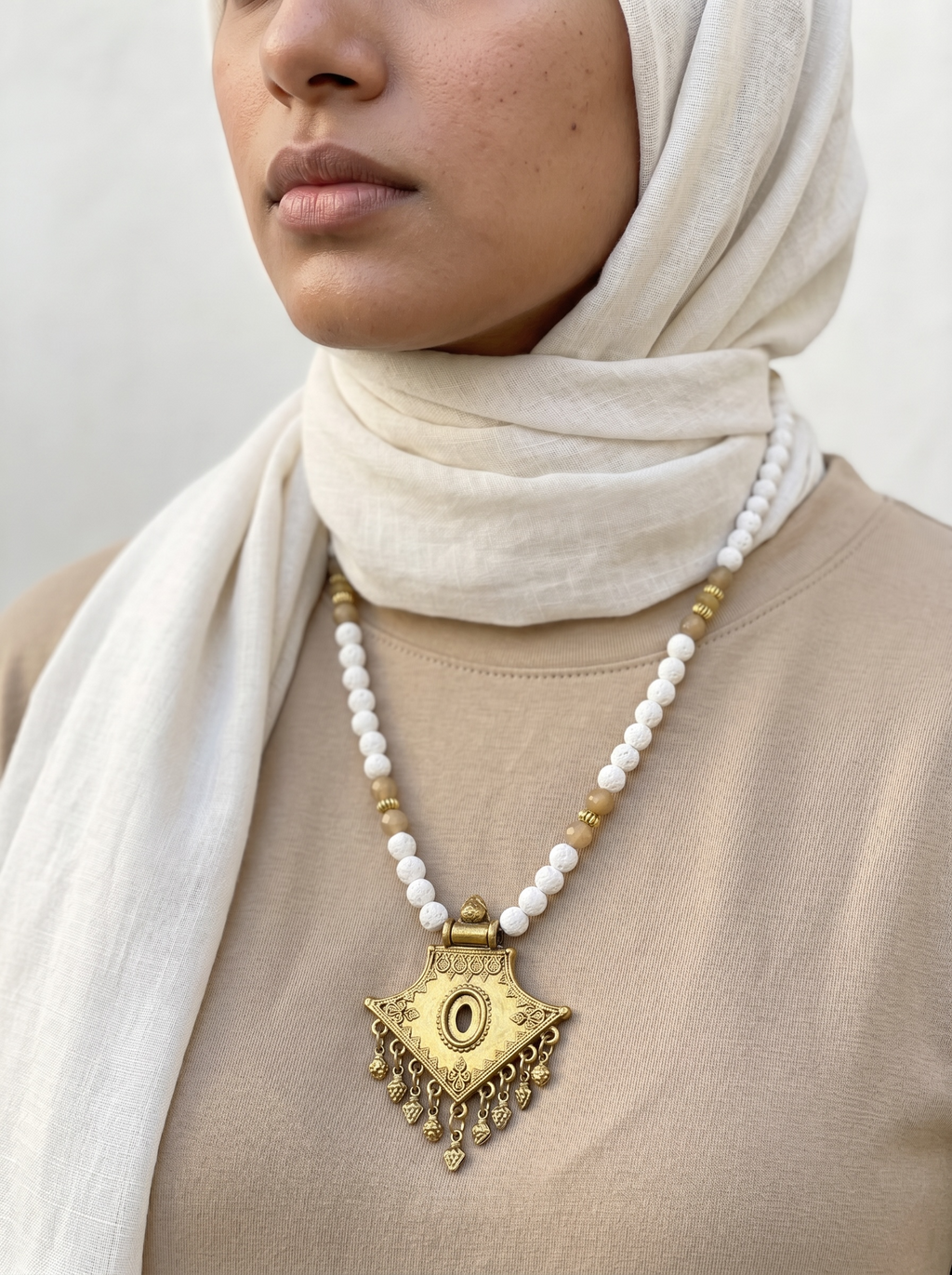 lava stone in white necklace with gold pendant | J247