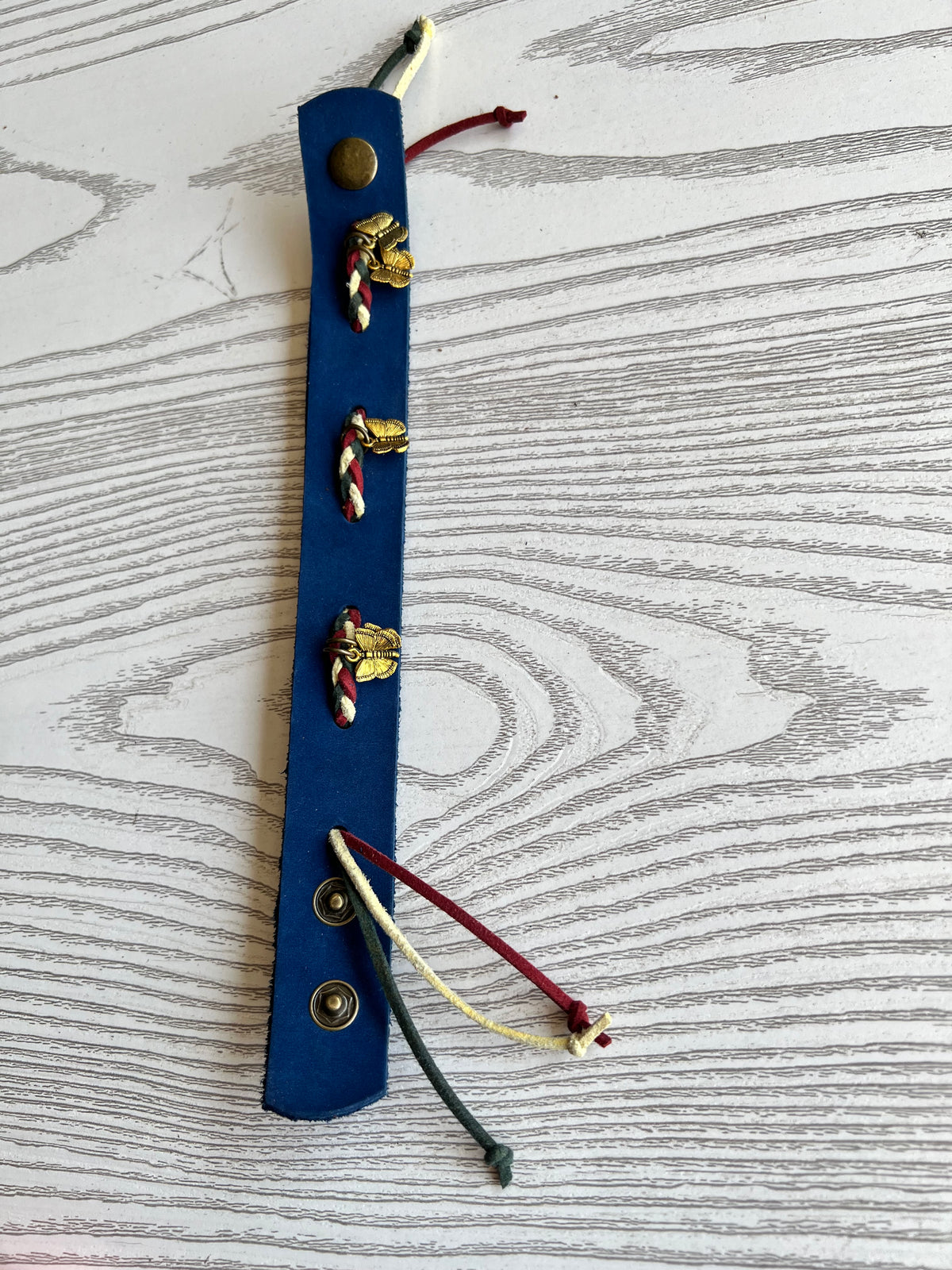Blue natural leather bracelet with gold butterfly metal