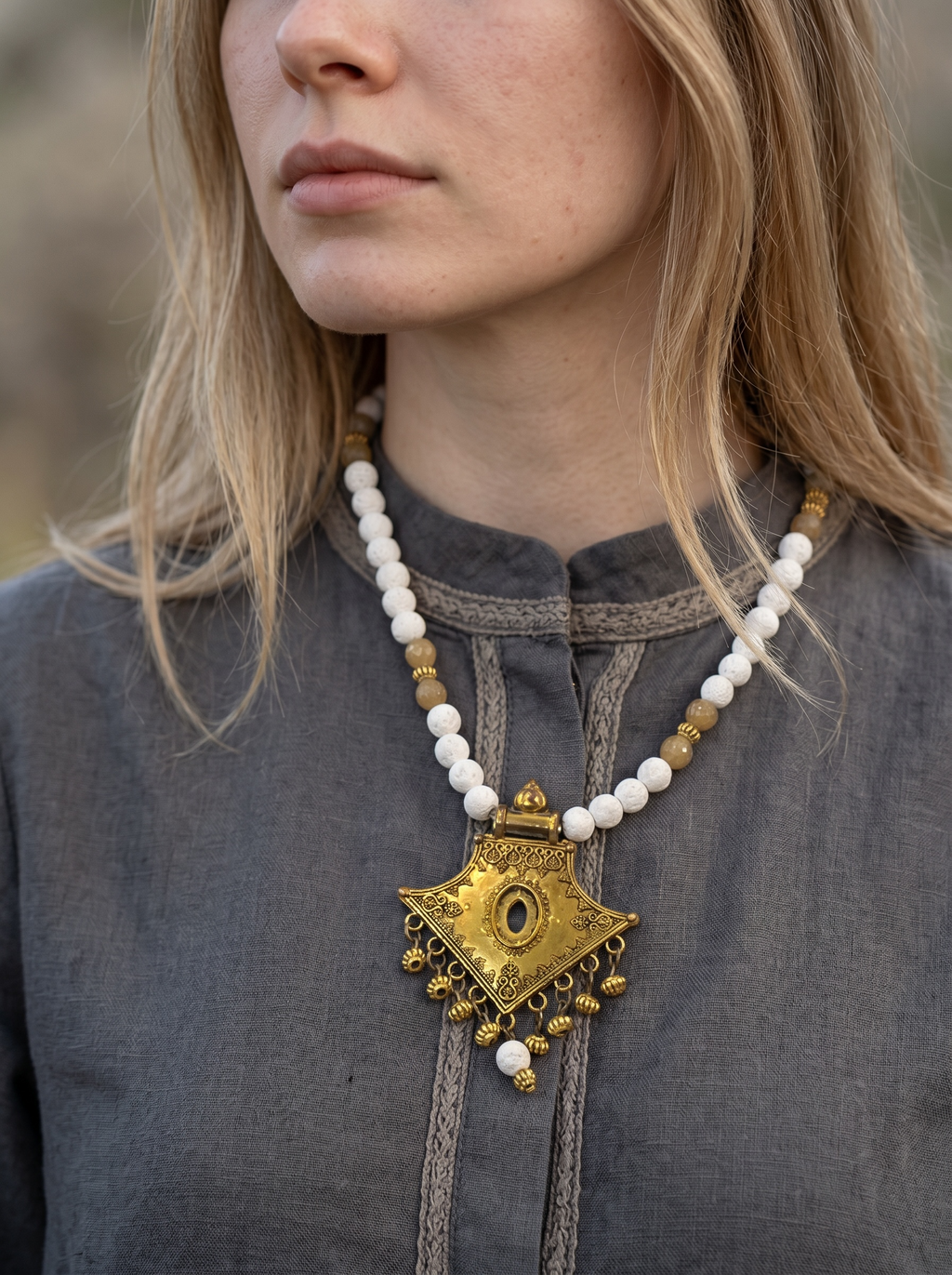 lava stone in white necklace with gold pendant | J247