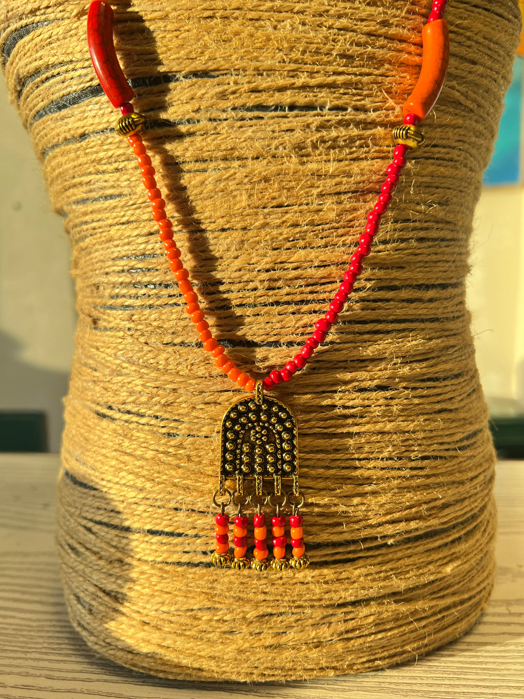 orange and red beaded necklace
