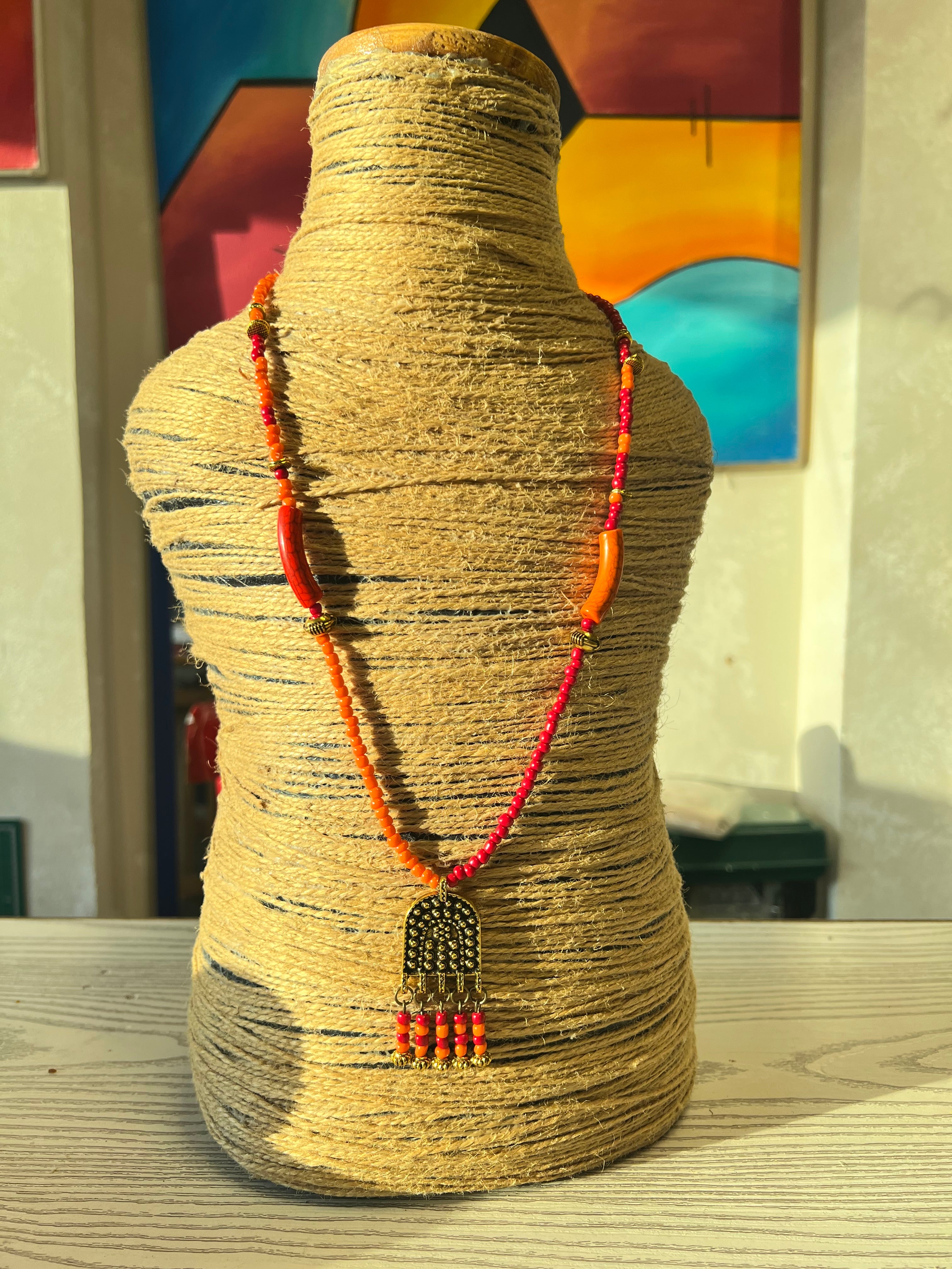 orange and red beaded necklace