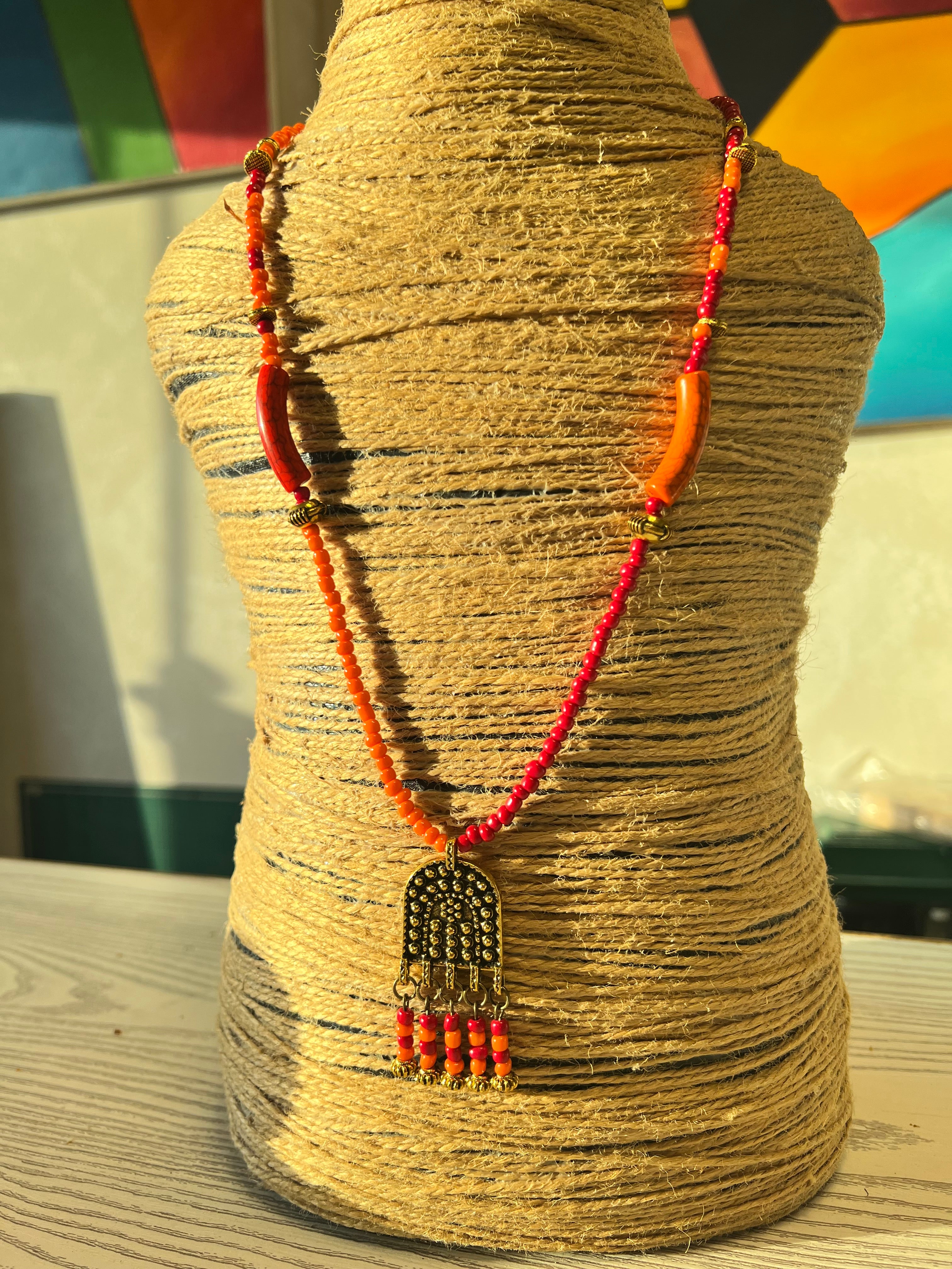 orange and red beaded necklace