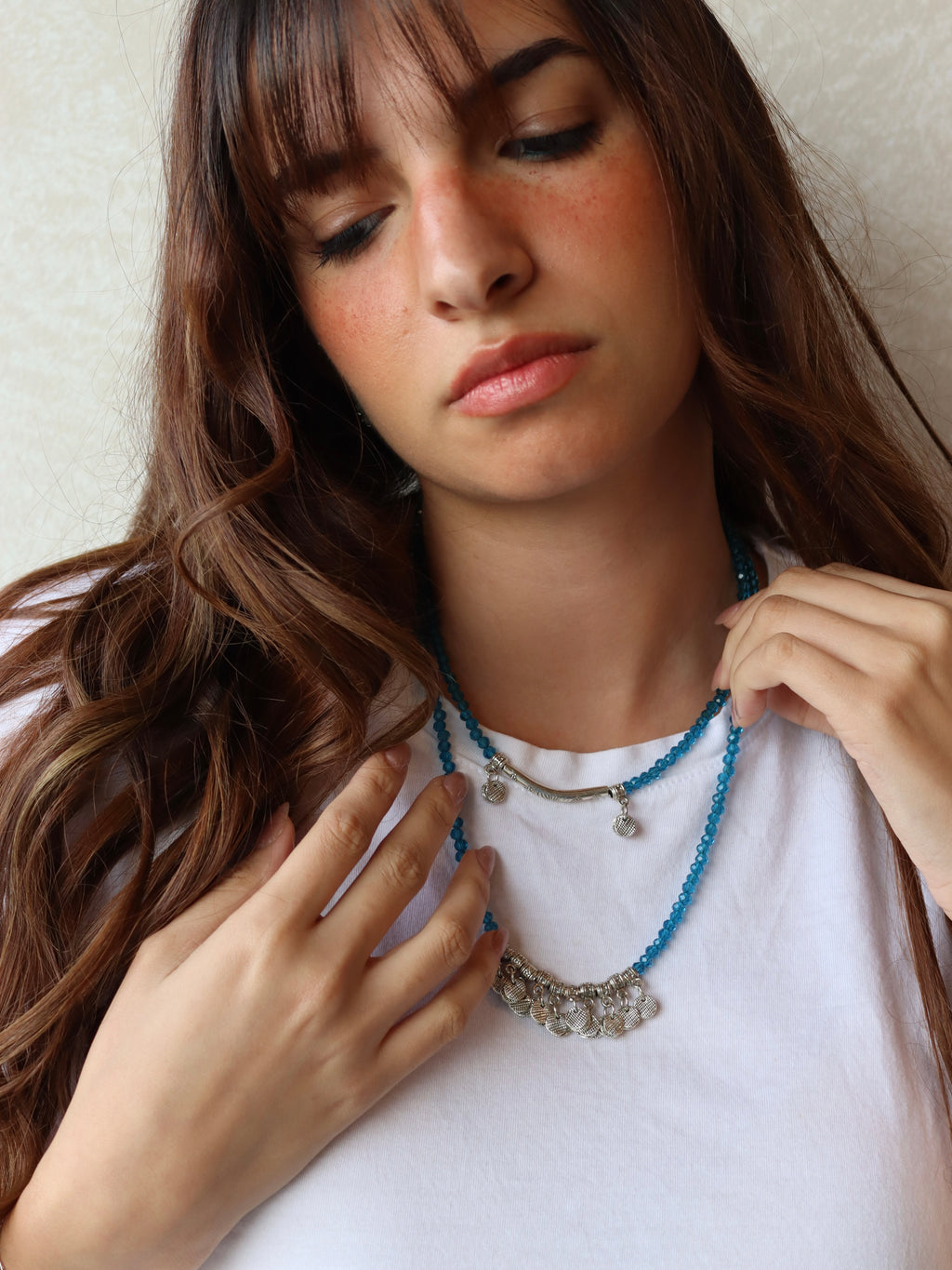 blue crystal layered necklace with silver metal