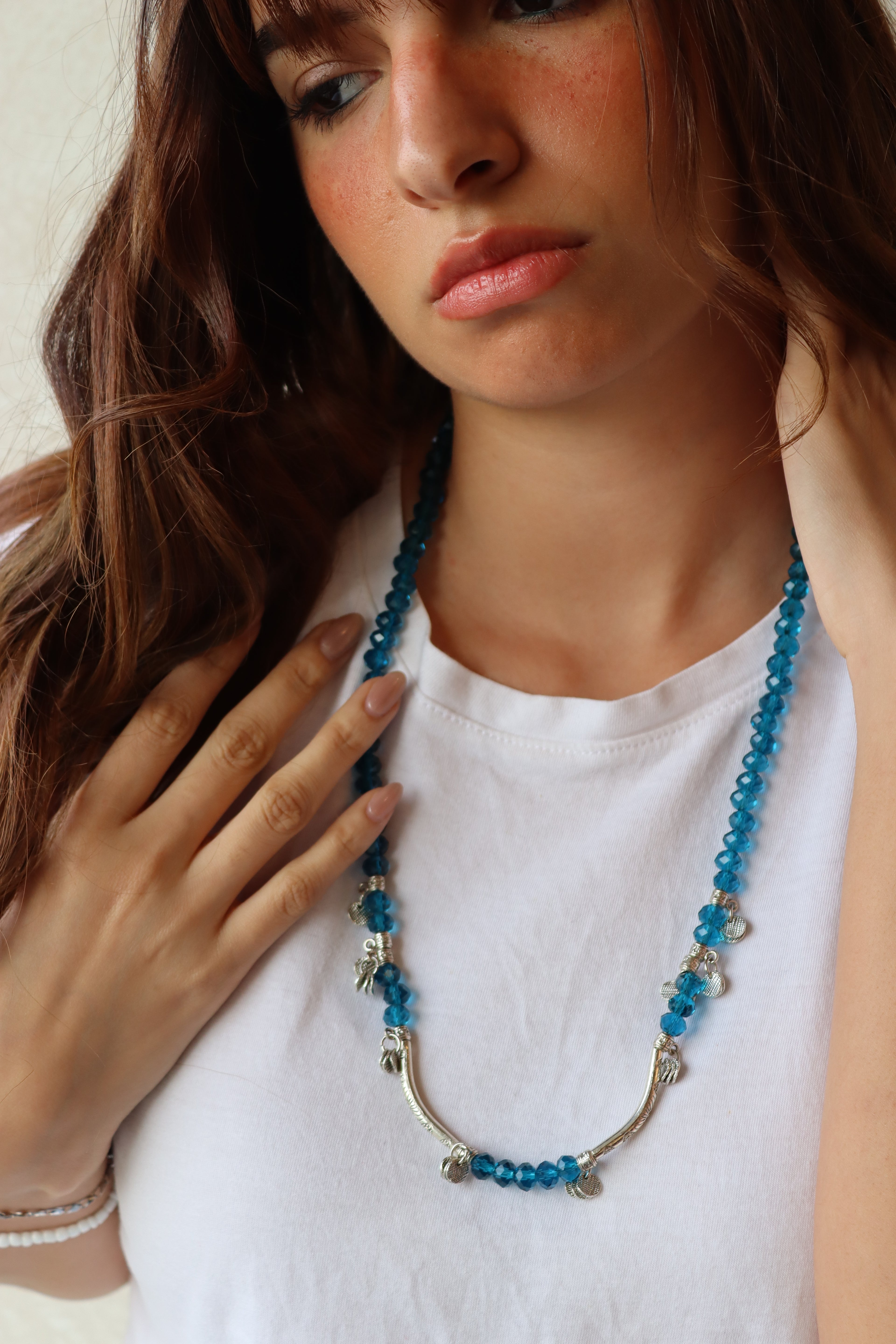 blue crystal layered necklace with silver metal