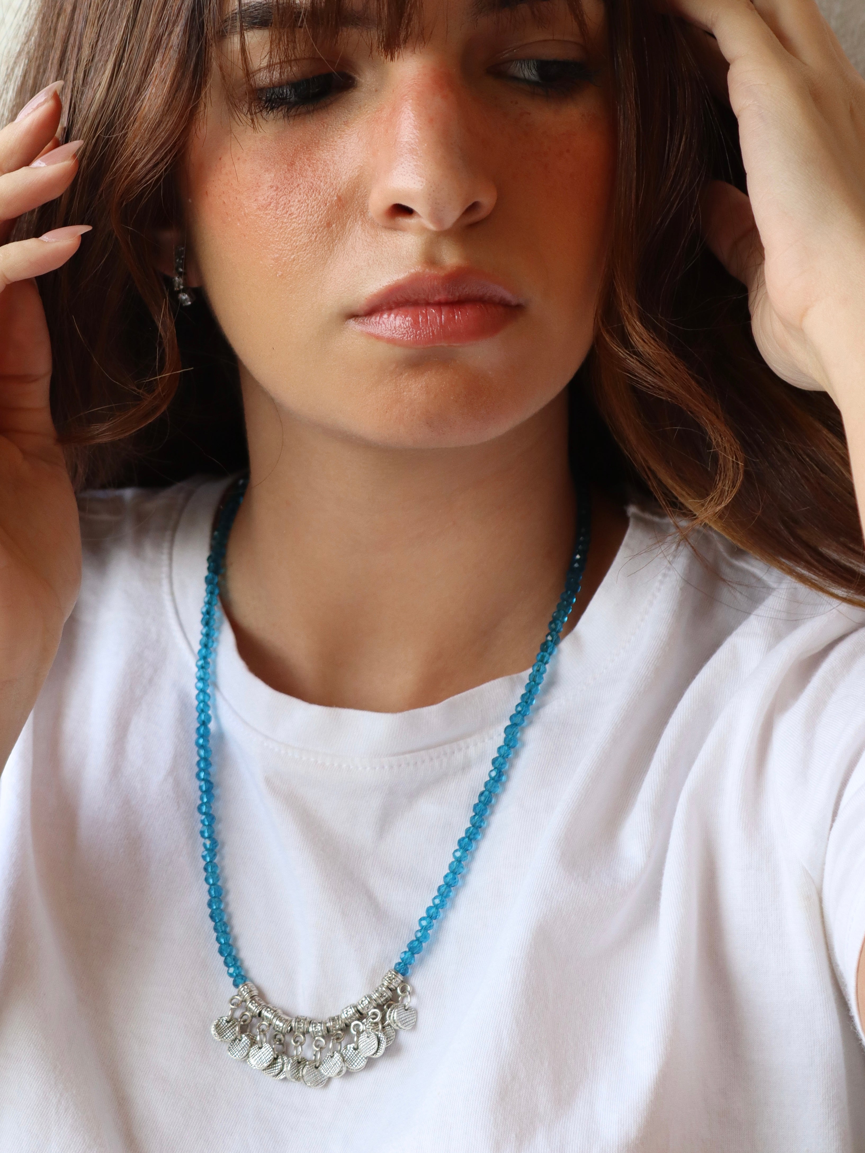 blue crystal layered necklace with silver metal