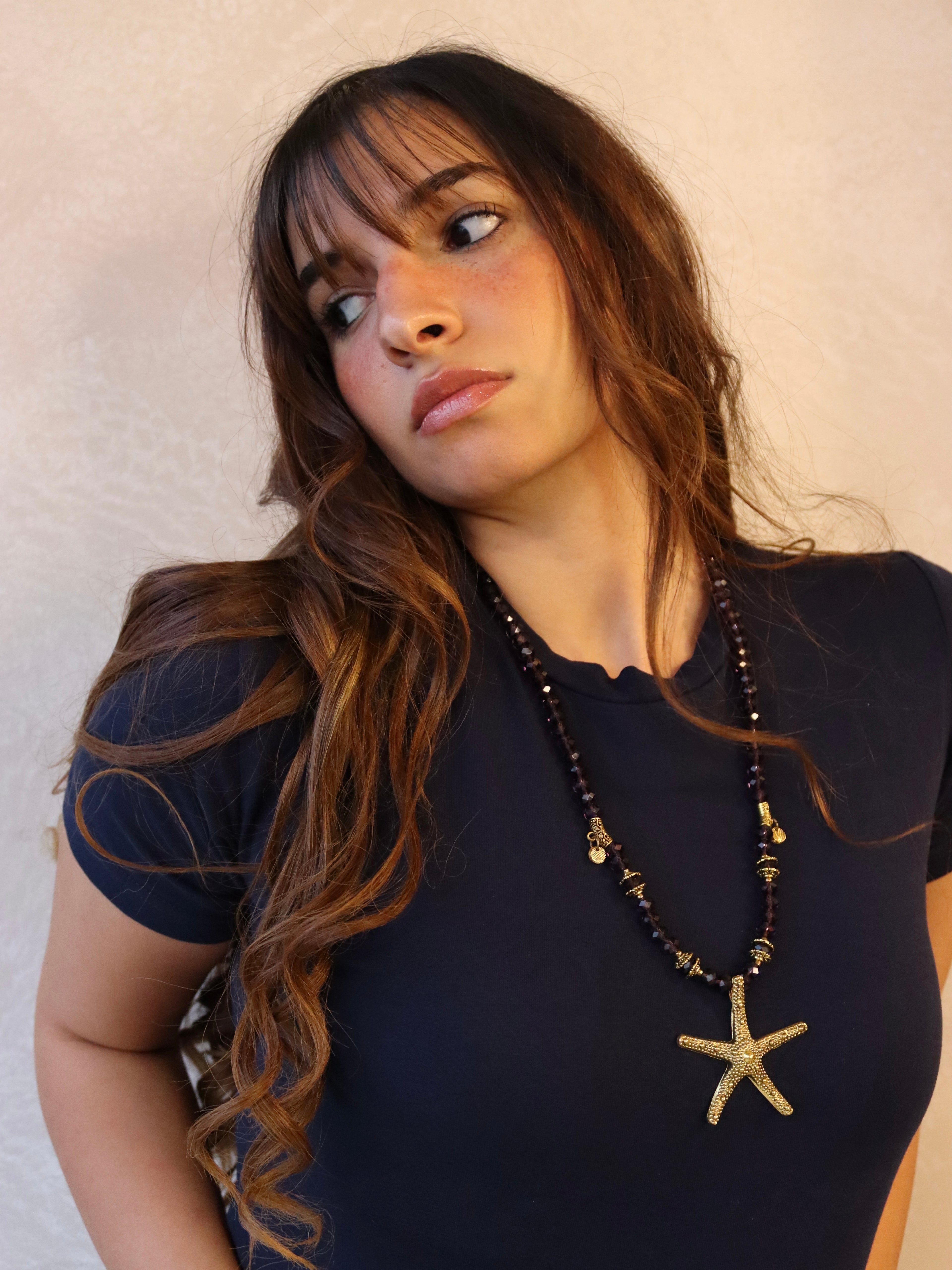 purple crystal necklace with gold metal star fish