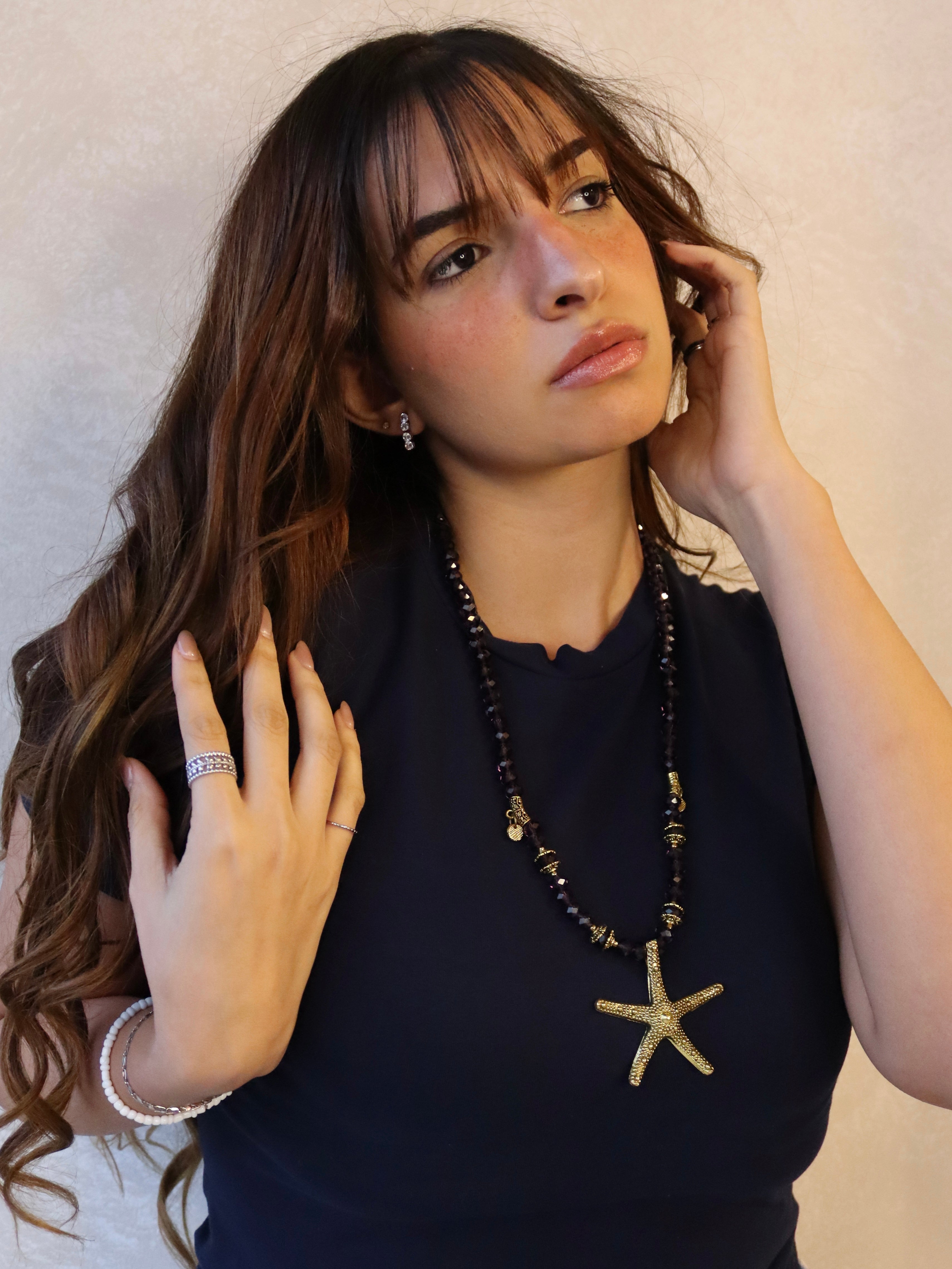 purple crystal necklace with gold metal star fish