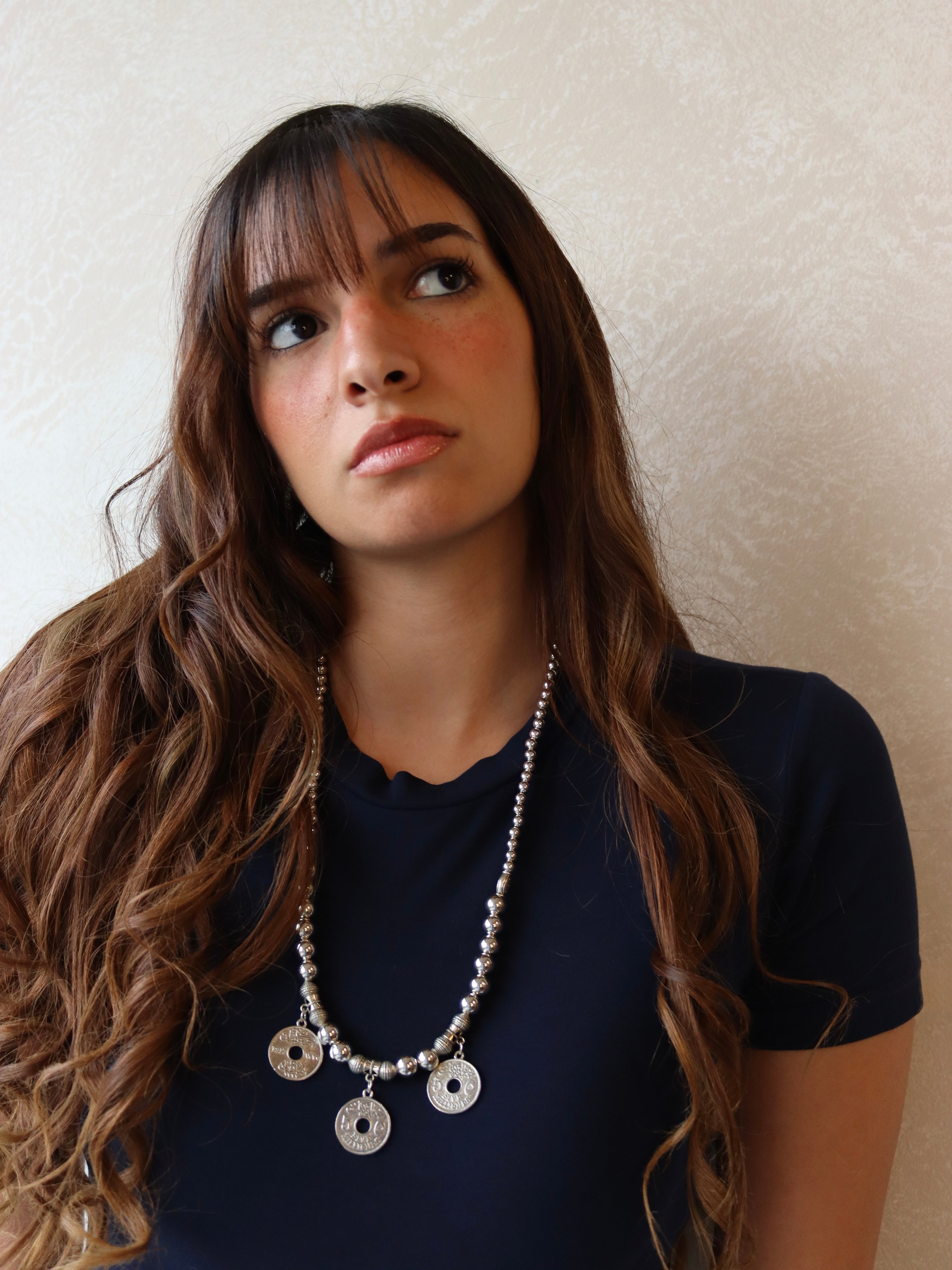 silver necklace with three silver coin