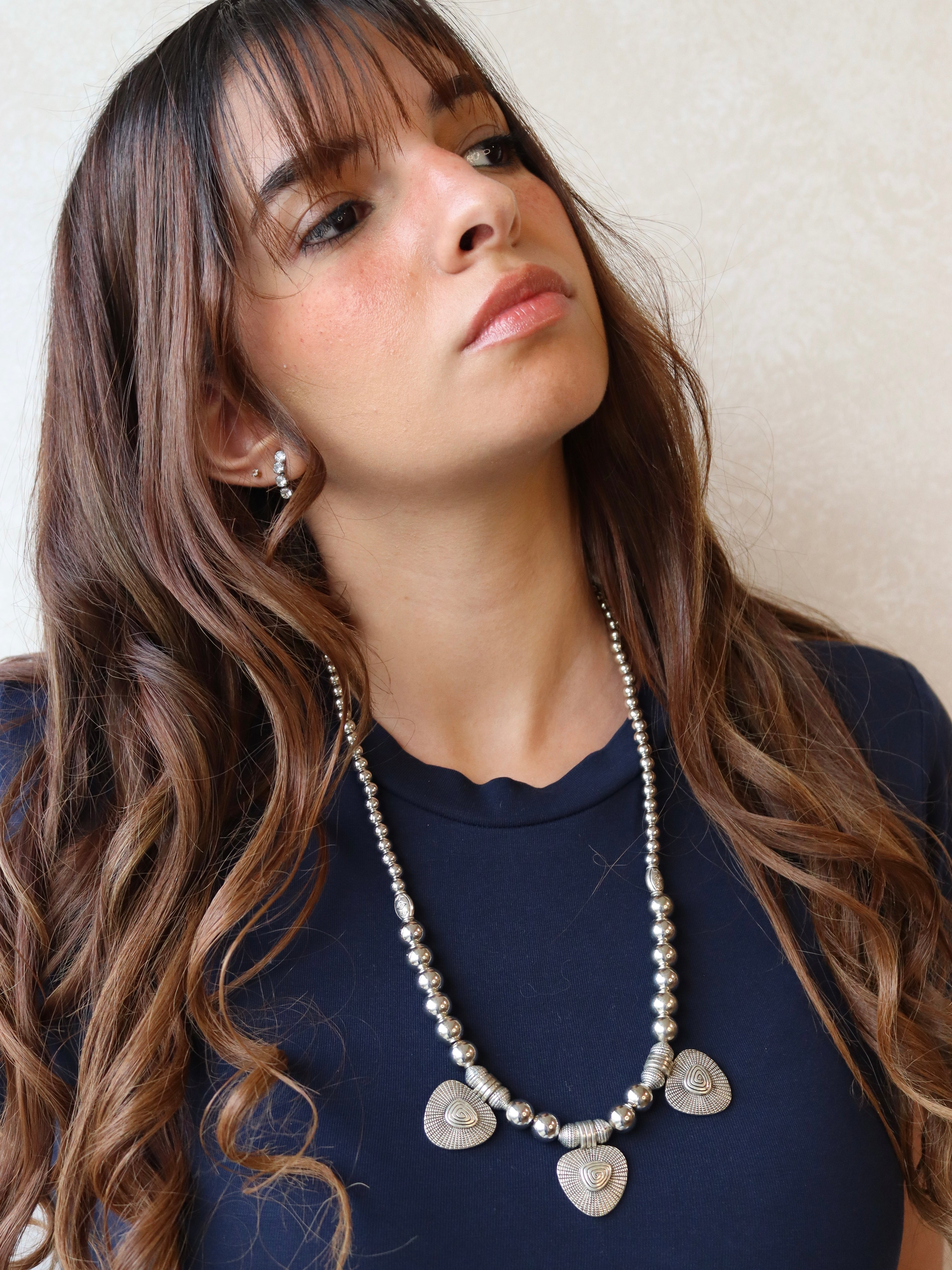 silver necklace with three silver shell