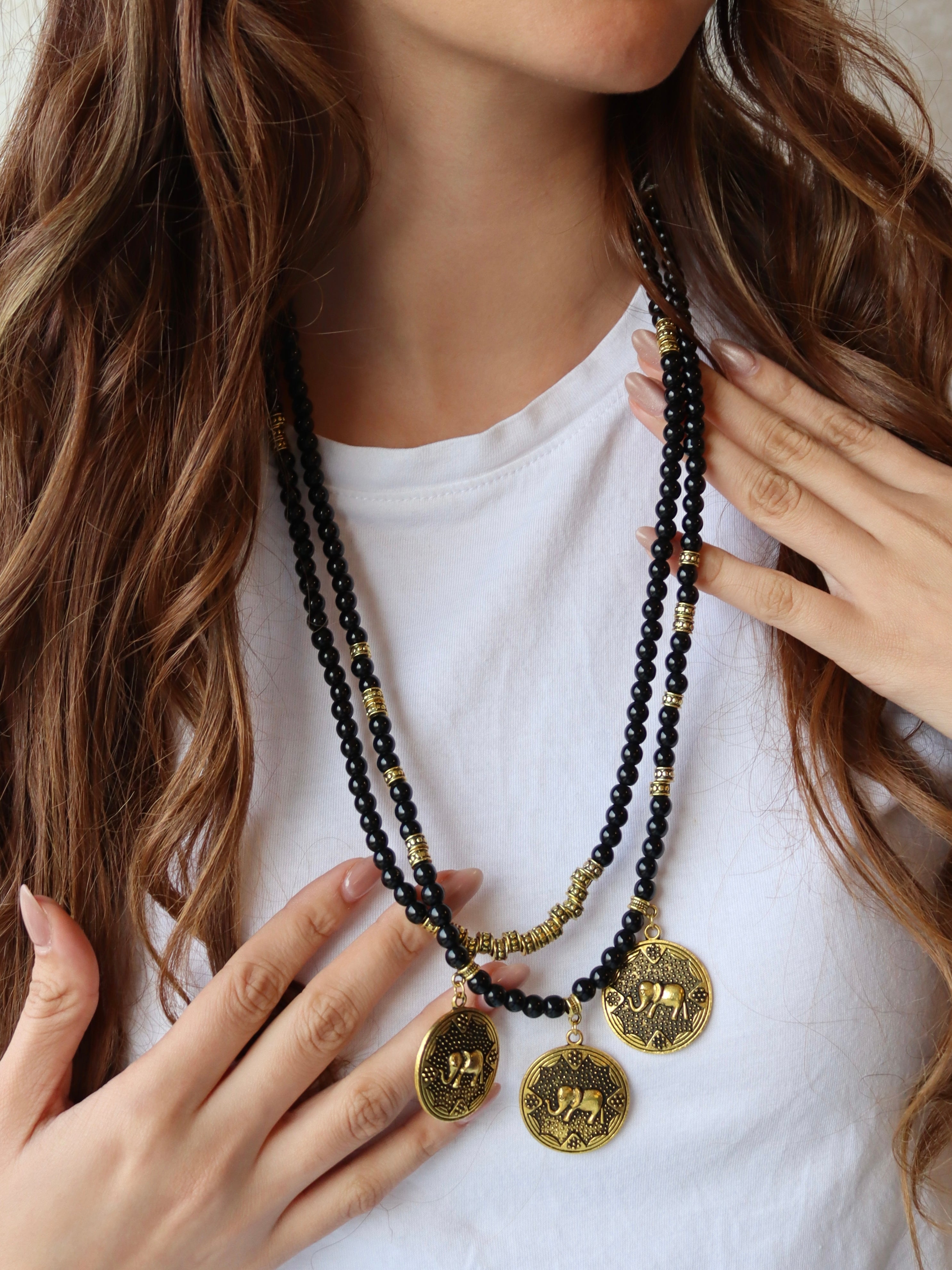 black beaded double layered necklace with three elephant gold metal
