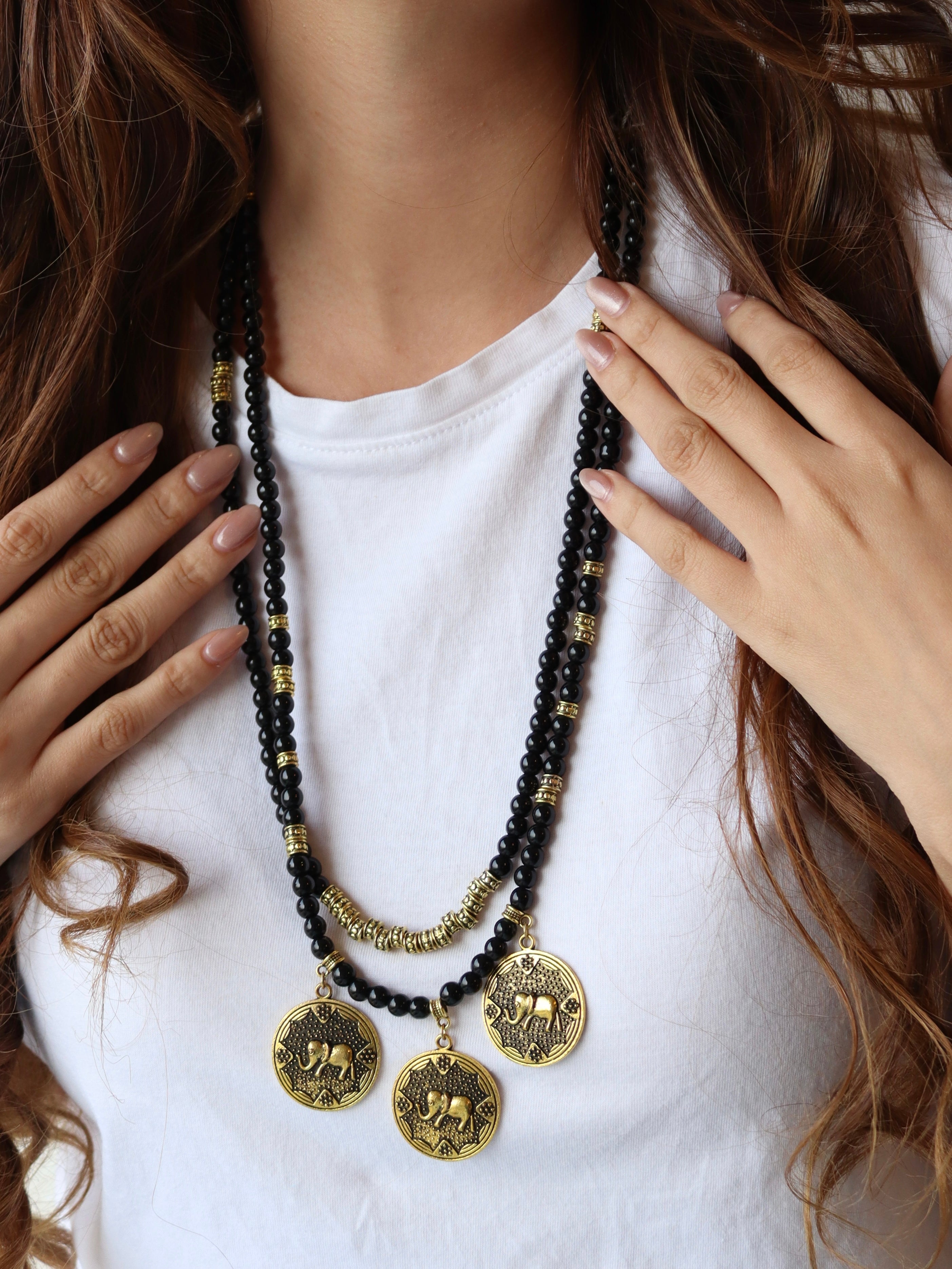 black beaded double layered necklace with three elephant gold metal