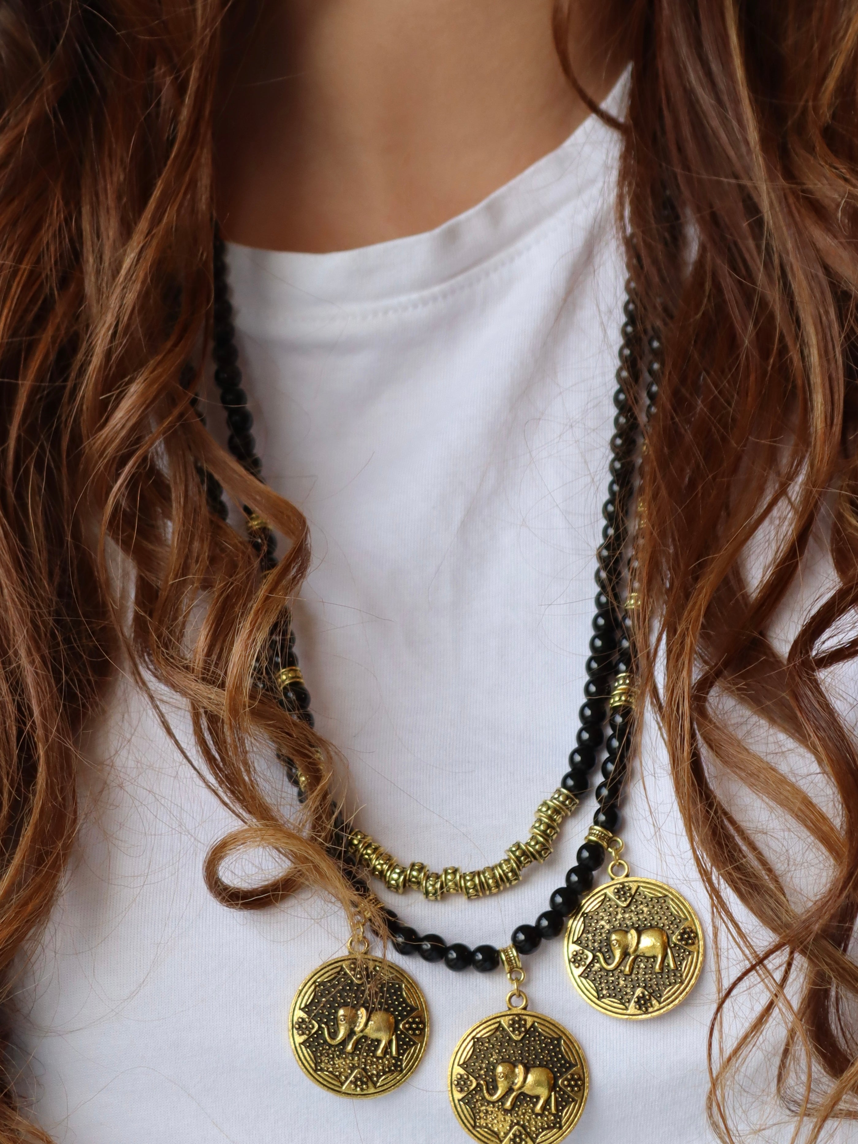 black beaded double layered necklace with three elephant gold metal