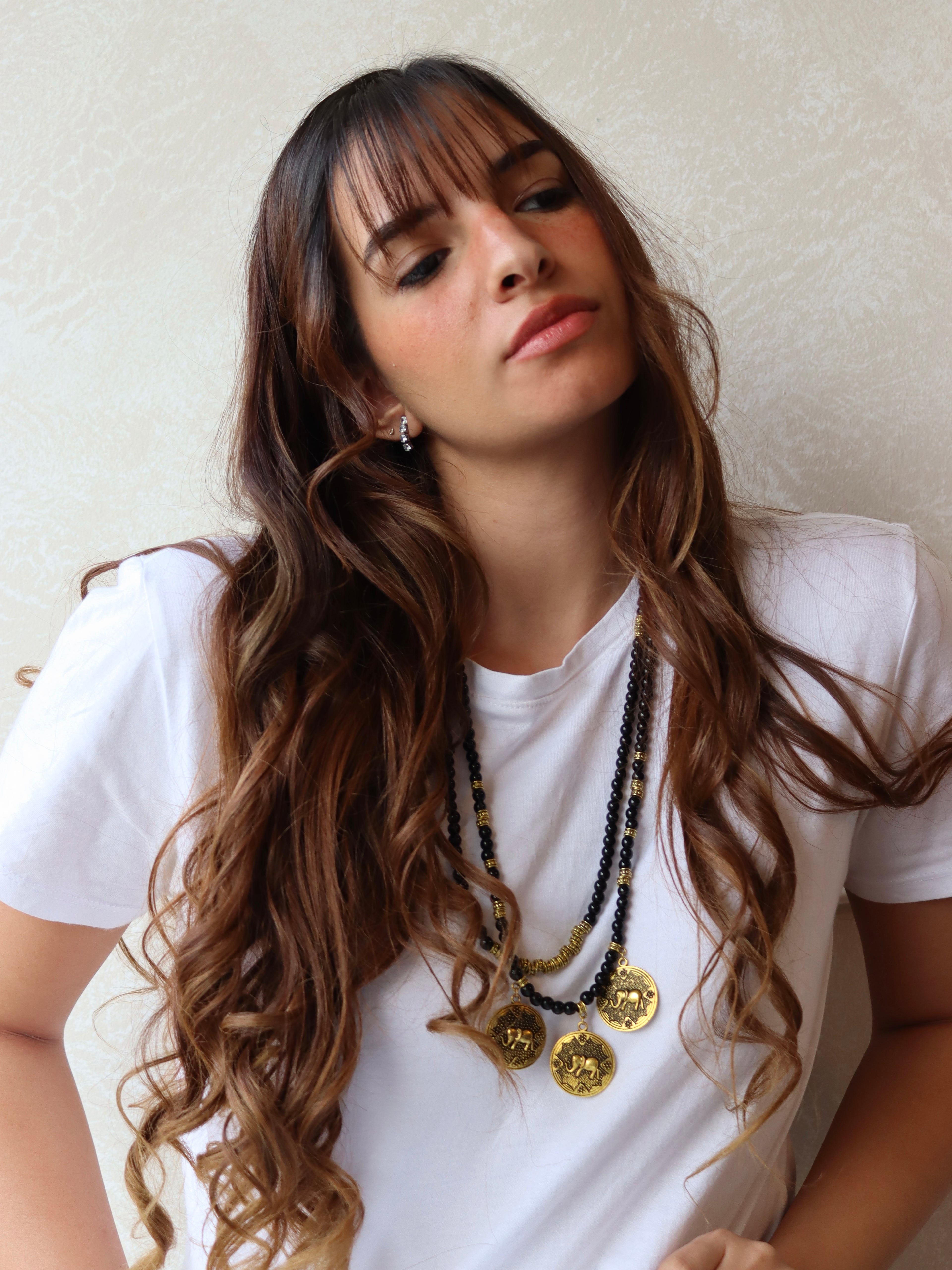 black beaded double layered necklace with three elephant gold metal