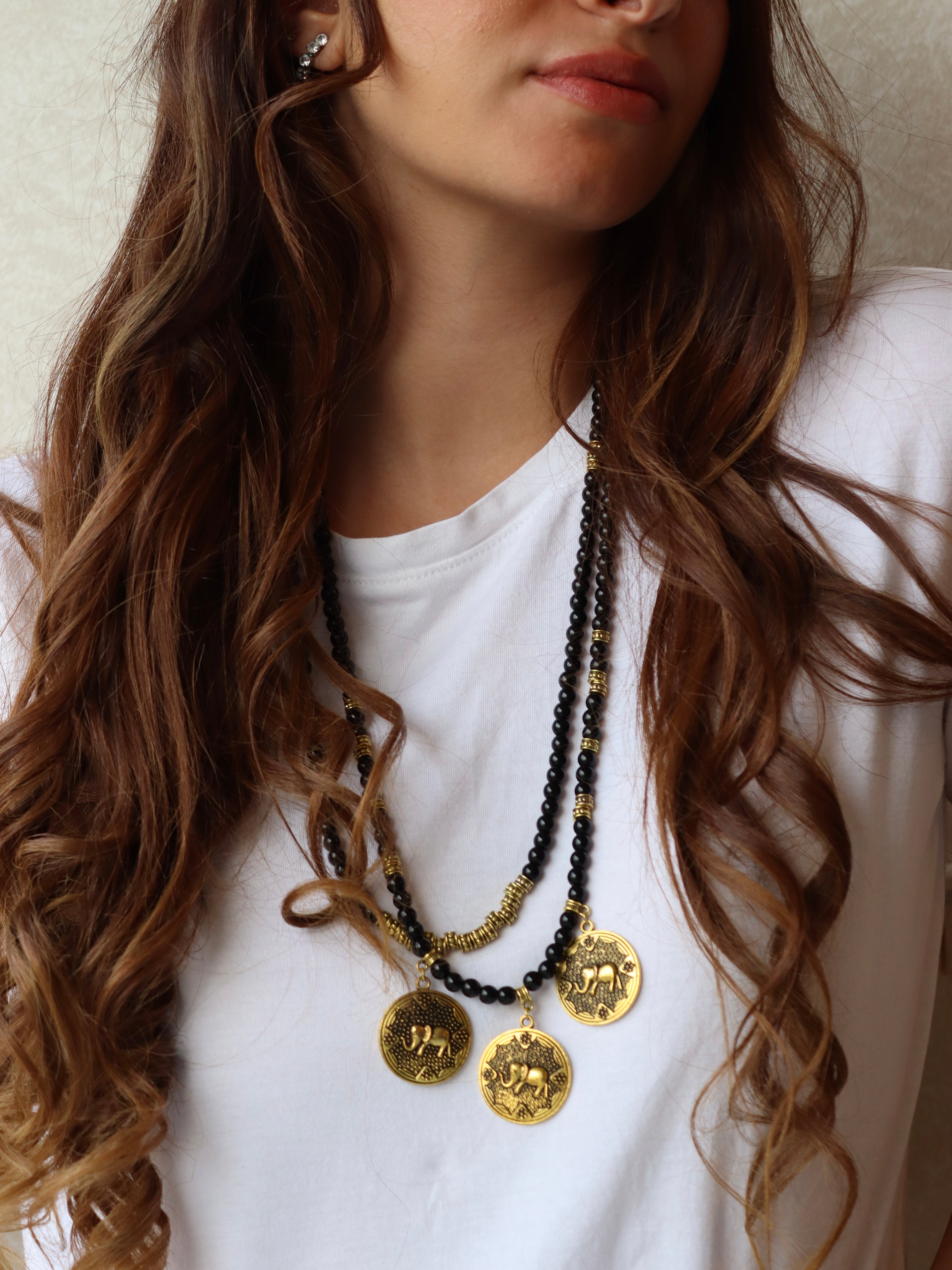 black beaded double layered necklace with three elephant gold metal