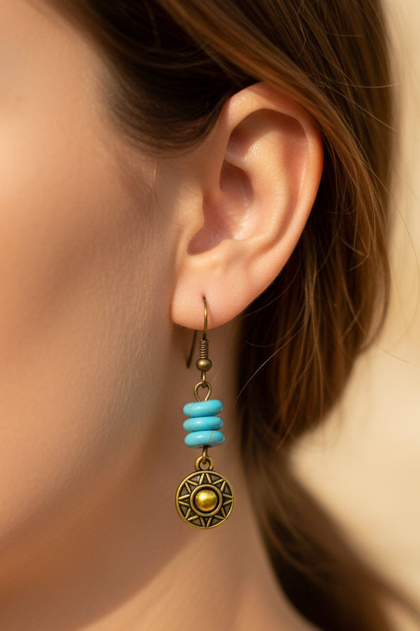 fayrouz with golden metal earrings | J225